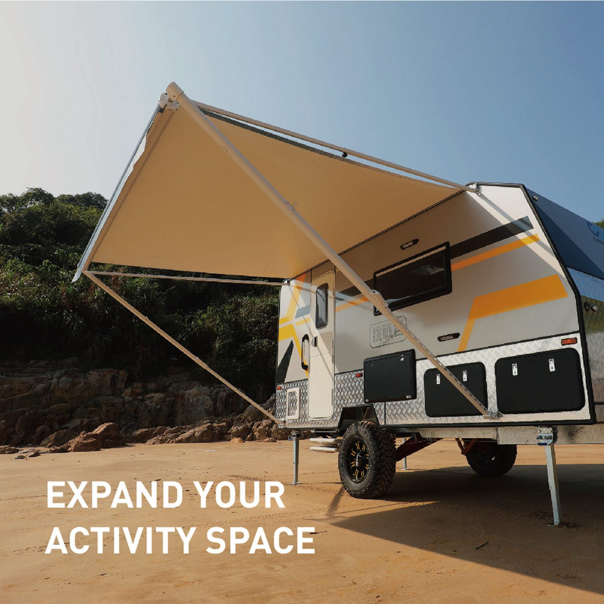 Awnlux RV awning fabric fully extended on a camper, showing the bottom fabric color and providing shade under a clear sky