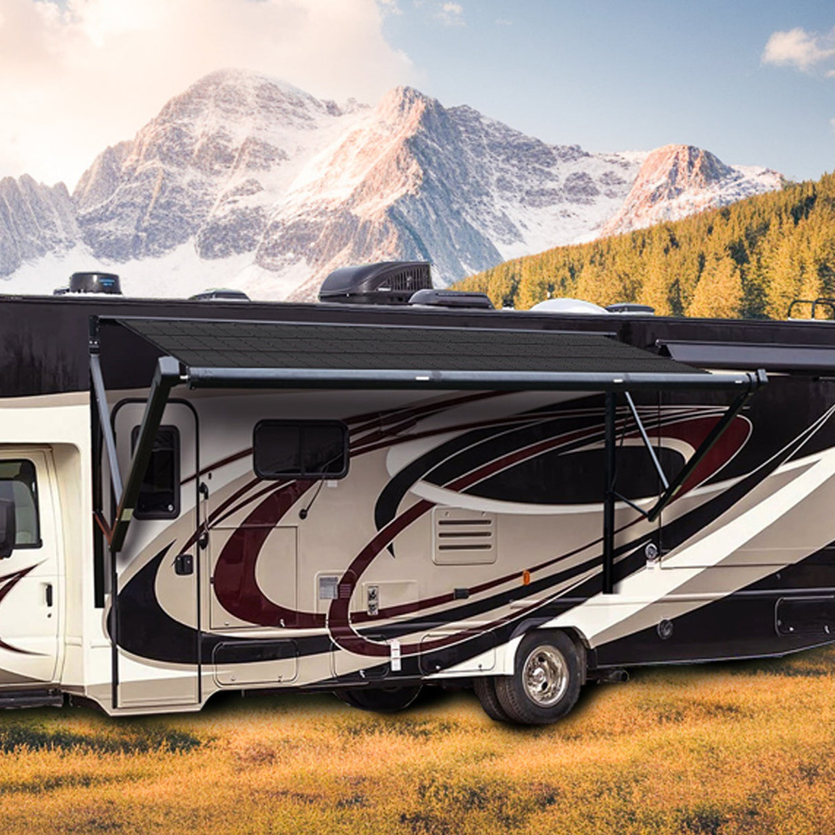 Class A motorhome equipped with AWNLUX solar powered RV awning extended, creating shaded campsite with mountain view