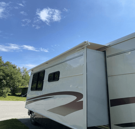 Why Should I Use an RV Slide Topper Awning? - AWNLUX